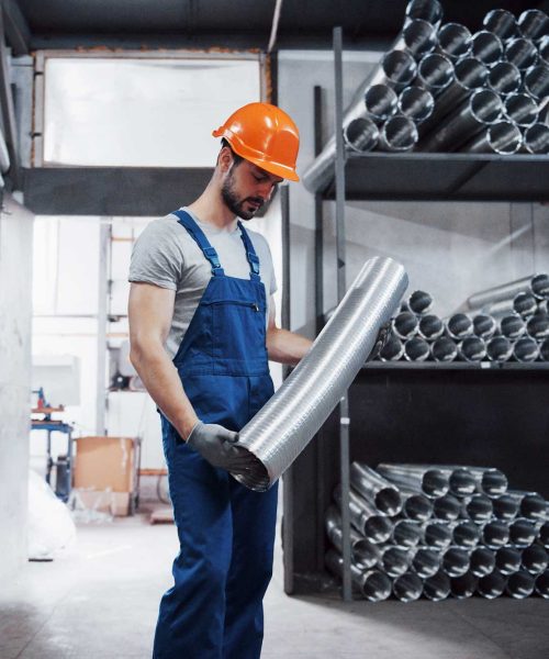 portrait-young-worker-hard-hat-large-metalworking-plant